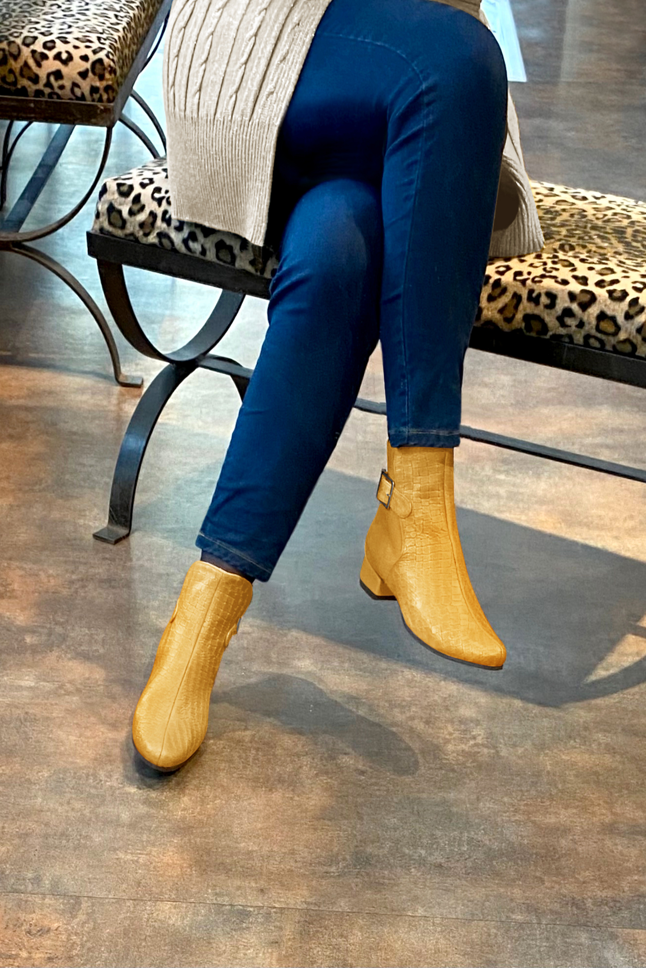 Mustard yellow women's ankle boots with buckles at the back. Round toe. Low block heels. Worn view - Florence KOOIJMAN